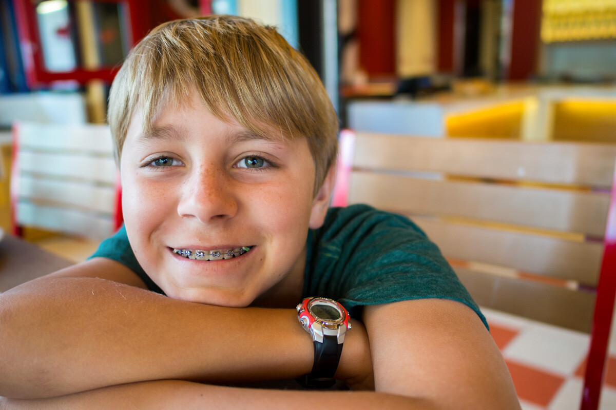 Young teenage boy with braces